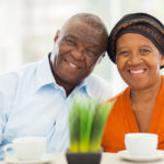 cute senior african couple at home